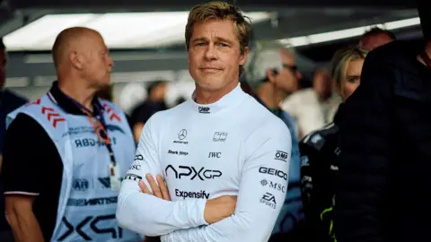 Getty Images Hollywood actor Brad Pitt, acting in an upcoming Formula One-based movie, follows the second practice session ahead of the Formula One British Grand Prix at the Silverstone motor racing circuit in Silverstone, central England, on July 5, 2024