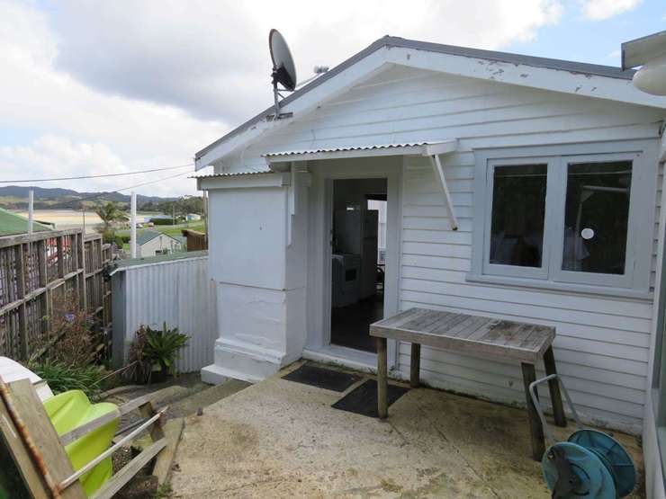 A two-bedroom leasehold bach at 9 Rockell Road, in Whananaki, Whangārei, has a $220,000 price tag. Photo / Supplied