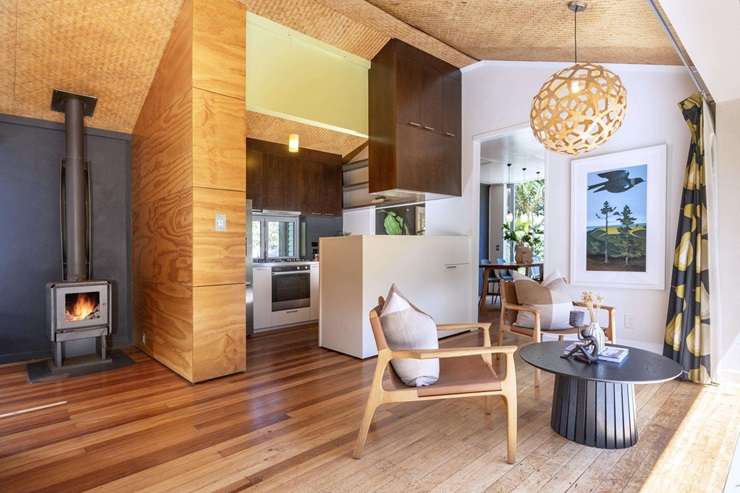 The two-bedroom bach on Karekare Road, in Karekare, was listed at the end of last year. Photo / Supplied