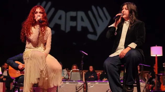 L- Chappell Roan, R- Lucy Dacus perform onstage during Artist for Aid benefit concert at Shrine Auditorium and Expo Hall Saturday, Jan. 10, 2026 in Los Angeles , CA. (Ronaldo Bolaños / Los Angeles Times via Getty Images)