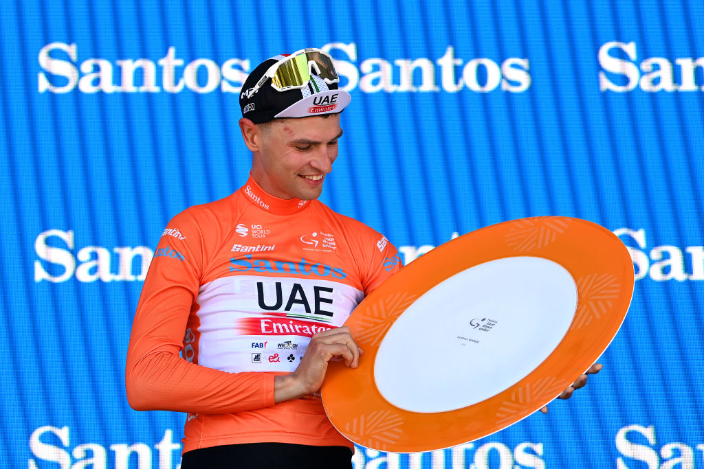MOUNT LOFTY, AUSTRALIA - JANUARY 22: Jay Vine of Australia and UAE Team Emirates celebrates at podium as Orange Leader Jersey during the 23rd Santos Tour Down Under 2023 - Stage 5 a 112,5km stage from Unley to Mount Lofty 727m / #TourDownUnder / #WorldTour / on January 22, 2023 in Mount Lofty, Australia. (Photo by Tim de Waele/Getty Images)