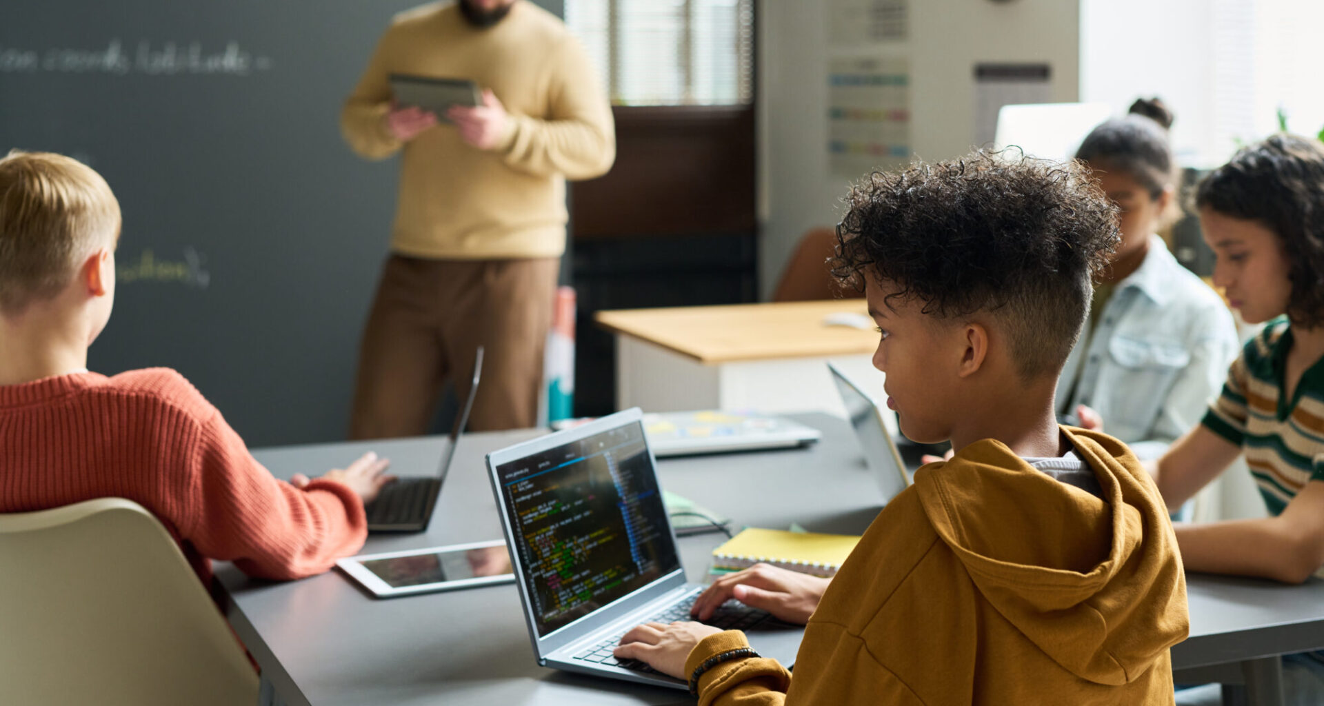no laptops - kids using computers in class...