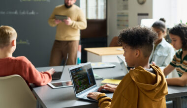 no laptops - kids using computers in class...