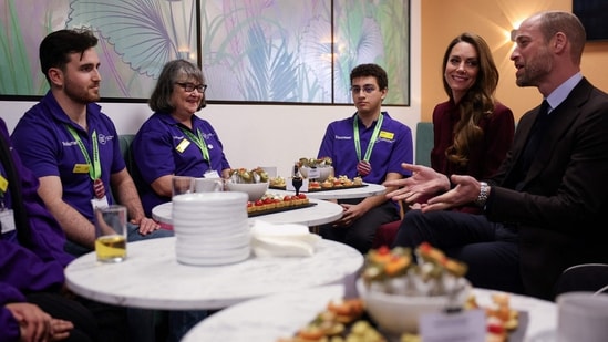 Britain's Prince William (R), Prince of Wales and Catherine (2nd R), Princess of Wales meet with volunteers of Imperial Health Charity during a visit to Charing Cross Hospital in west London on January 8, 2026, to highlight the work of NHS staff and volunteers. (Photo by Isabel Infantes / POOL / AFP)(AFP)