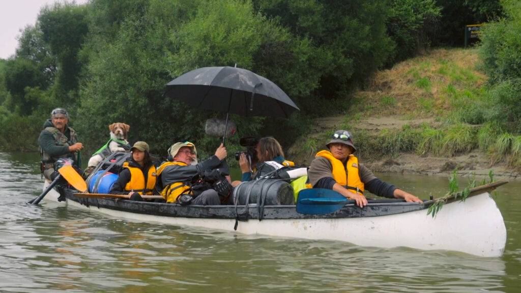 Ned Tapa guides the cast and crew of “I Am The River, The River Is Me” down the Whanganui River. Credit: Richard Sidey