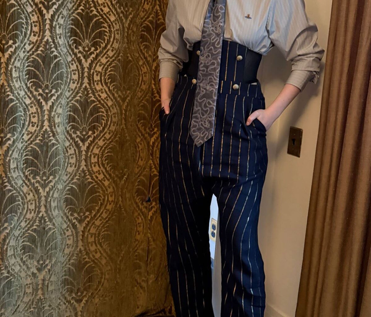 Elle Fanning Wore Vivienne Westwood For The Kelly Clarkson Show, Elle Fanning, Vivienne Westwood Spring 2026, The Kelly Clarkson Show, Sentimental Value film, Elle Fanning style evolution, tailored womenswear, modern power dressing, pinstripe trousers look, corsetry tailoring