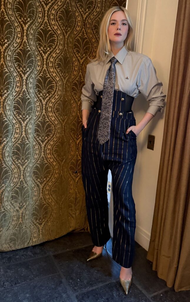 Elle Fanning Wore Vivienne Westwood For The Kelly Clarkson Show, Elle Fanning, Vivienne Westwood Spring 2026, The Kelly Clarkson Show, Sentimental Value film, Elle Fanning style evolution, tailored womenswear, modern power dressing, pinstripe trousers look, corsetry tailoring