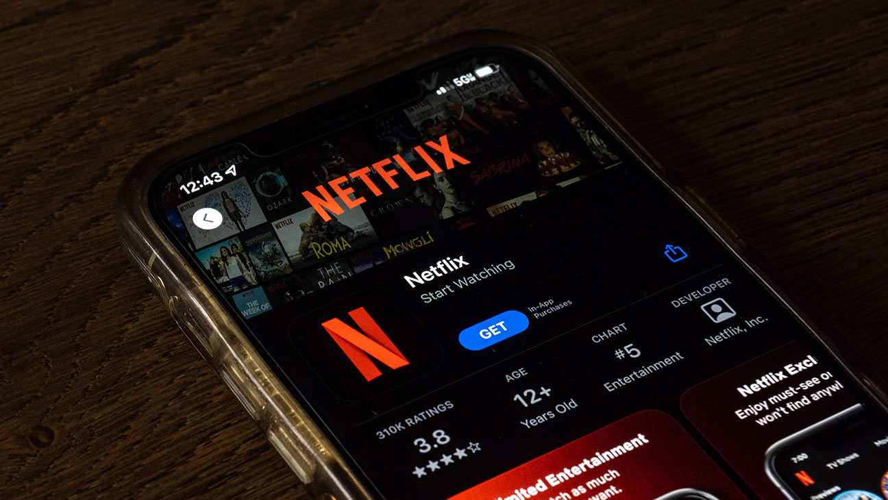Netflix app is shown on a mobile phone.