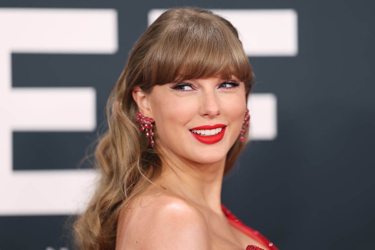 Taylor Swift stuns at best friend’s wedding in controversial gown - The Independent