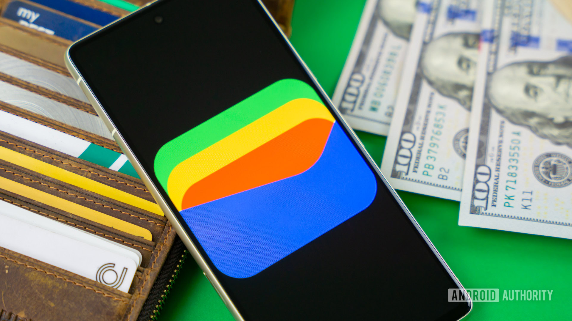 Google Wallet logo on smartphone next to credit cards and cash Stock photo 11 Google Wallet logo on smartphone next to credit cards and cash Stock photo 11