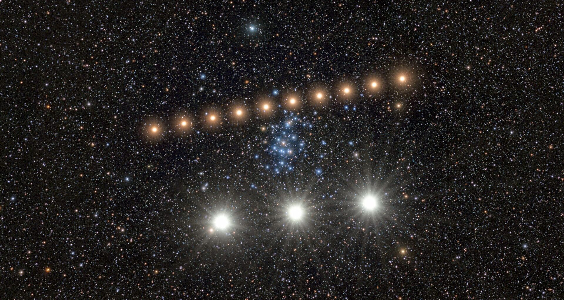 A series of bright golden dots form a diagonal line in the center of a starry night, with three larger whiter dots at the bottom of the image.