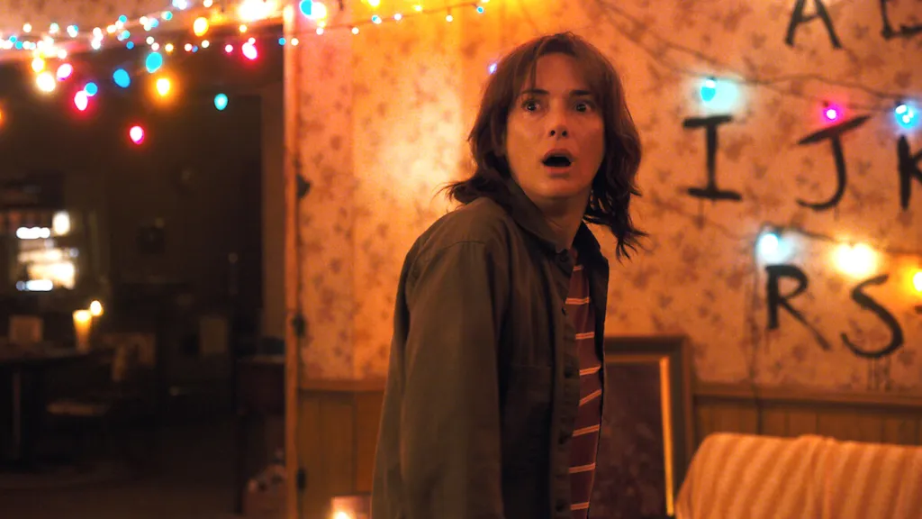 Winona Ryder looking shocked as Joyce Byers in Stranger Things Season 1