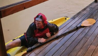 Brave dad saves daughter and partner from flooded home by kayak