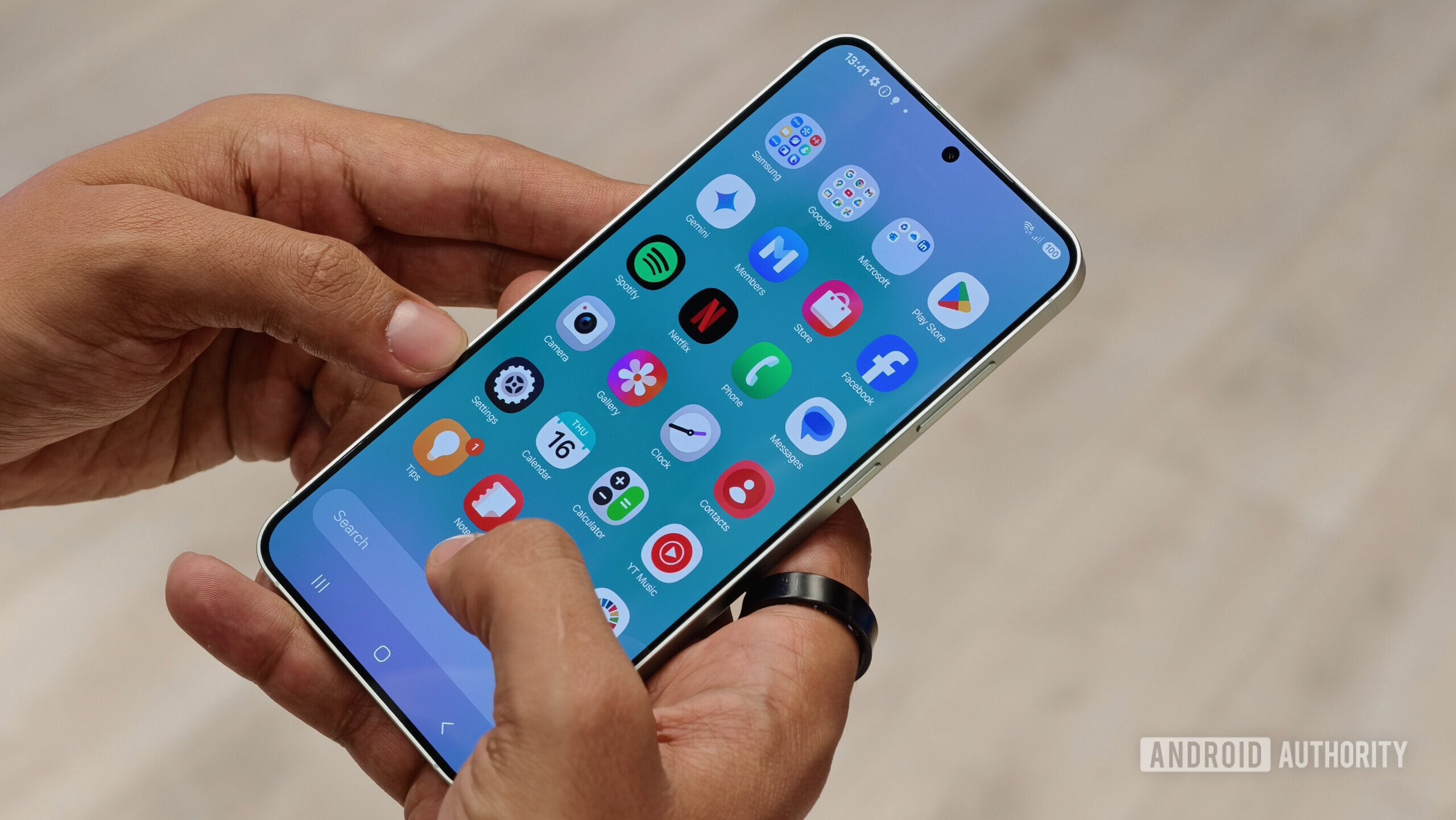 Samsung Galaxy S25 in hand showing home screen Samsung Galaxy S25 in hand showing home screen