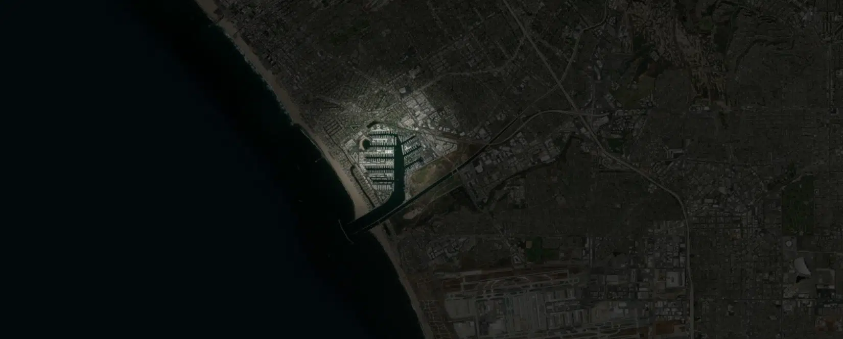 Simulated Satellite View Of Space Mirror Light Illuminating California’s Coast At Night.