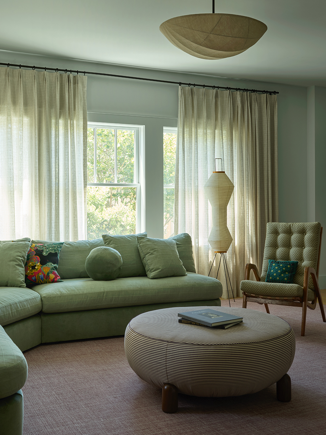 green living room with curved sofa