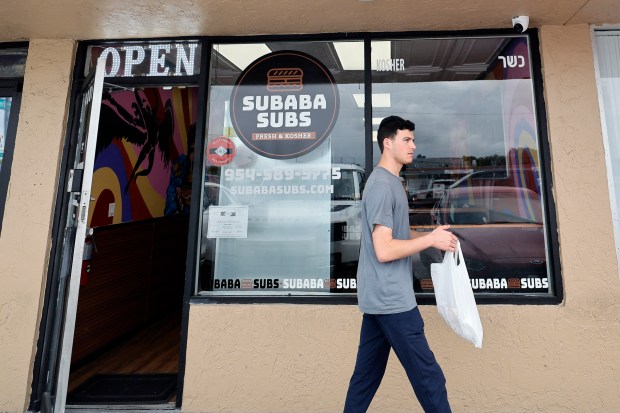 A customer leaves Subaba Subs with his order on Thursday, Jan. 22, 2026. (Amy Beth Bennett / South Florida Sun Sentinel)