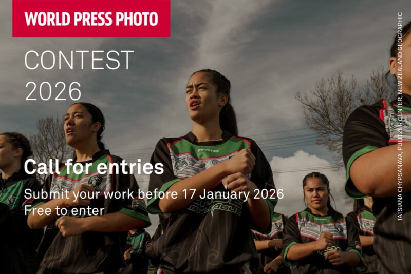 Several young women wearing matching sports uniforms stand outdoors in formation, hands on chests, under a cloudy sky. Text on the image announces the 2026 World Press Photo contest call for entries.