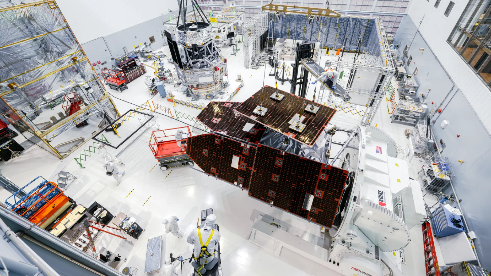 Photo of people building the Roman telescope in a large white room