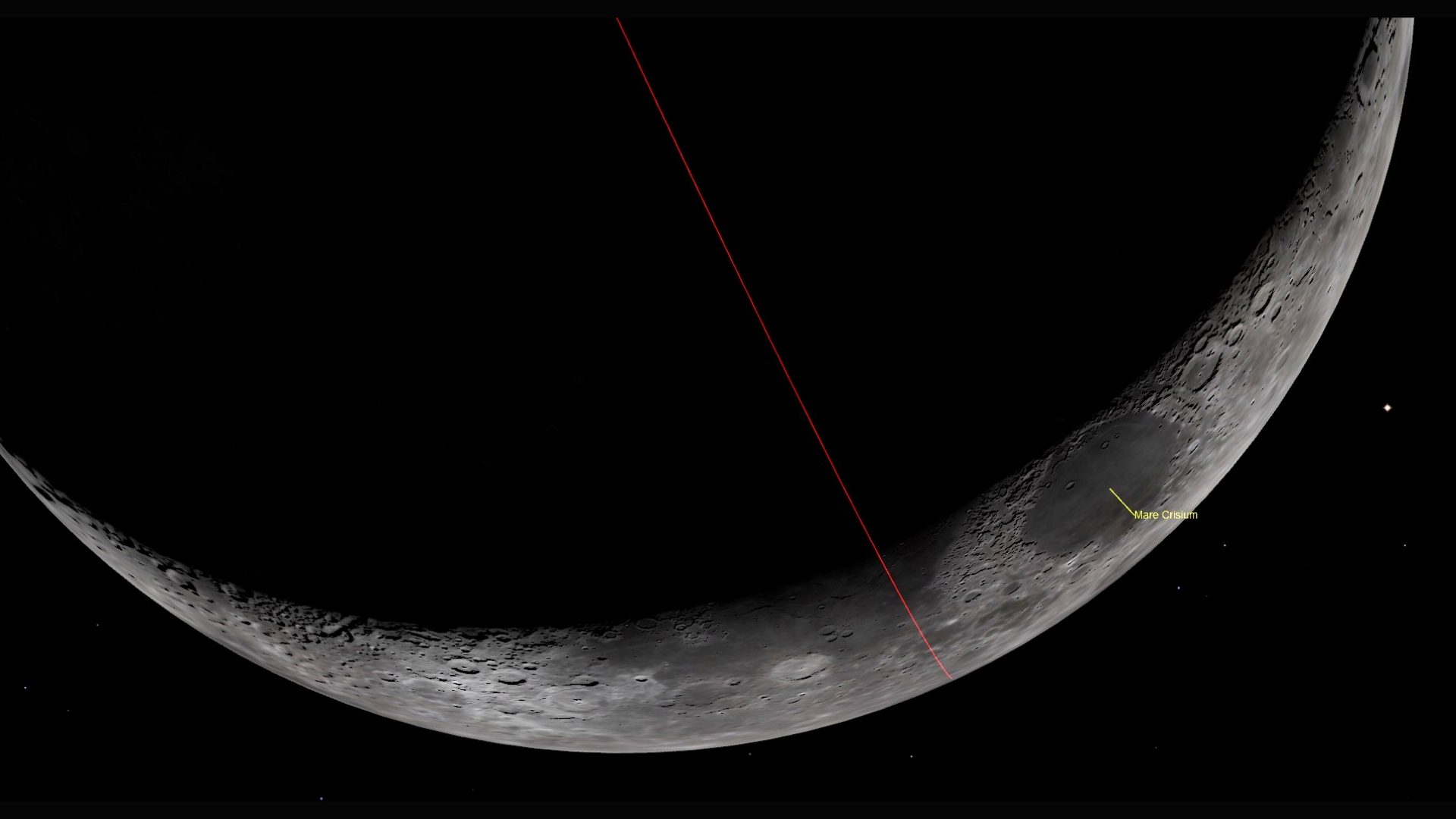 A close up of the surface of the moon, with only its curve illuminated. A red line bisects it in half diagonally from top left to bottom right and a labeled yellow dot shows Mare Crisium on its surface.