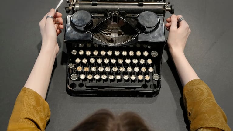 A Bonhams employee displays a Royal Portable Typewriter Owned By Orson Welles, manufactured circa 1931, serial no. P283613, by Royal Typewriter Co. Inc