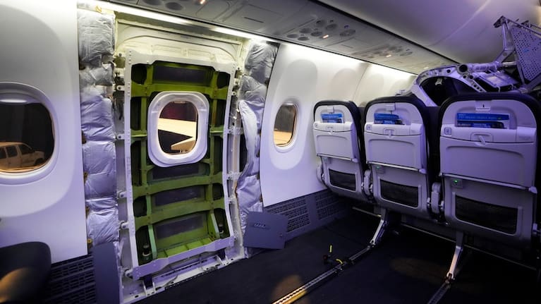 A door plug area of an Alaska Airlines Boeing 737 Max 9 aircraft awaiting inspection is pictured with panelling removed at the airline's facilities at Seattle-Tacoma International Airport. 