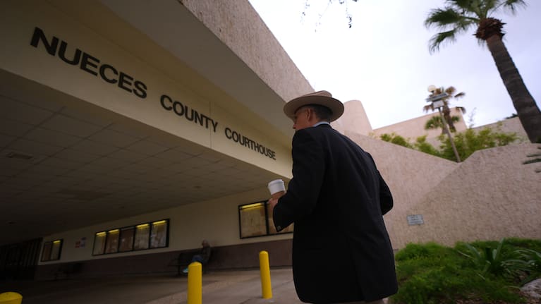 A man enters the Nueces County Courthouse in Corpus Christi, Texas, as jury selection continues in the trial for former Uvalde school district police officer Adrian Gonzales.