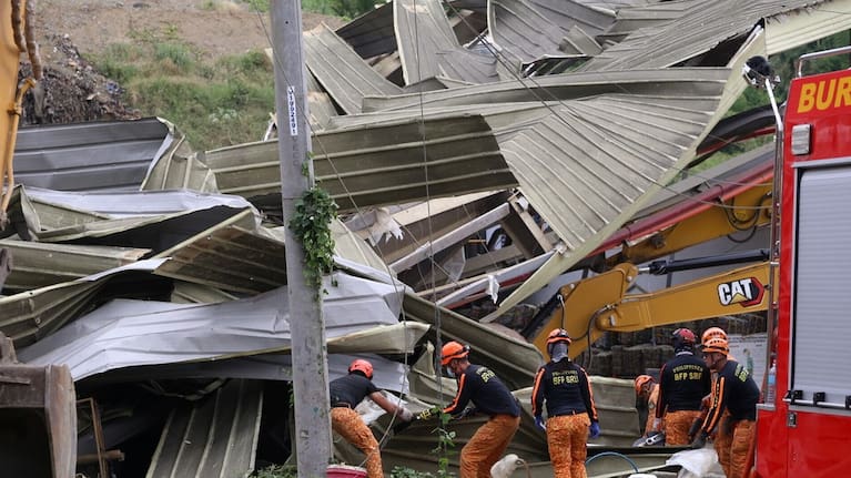 A Search and rescue operation continues after a huge mound of garbage collapsed at a waste segregation facility in Binaliw.