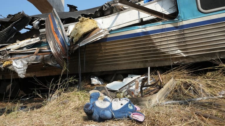 A stuffed animal lies on the ground at the site of a train accident in Nakhon Ratchasima province, Thailand.
