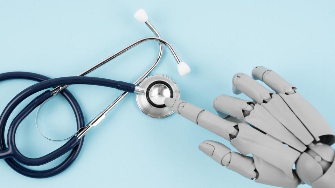Robot hand toy finger and medical stethoscope on blue background, AI and smart technologies in medicine and diagnostic concept