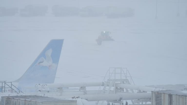 Airport crew plow snow during a winter storm in Philadelphia, Sunday, Jan. 25, 2026.