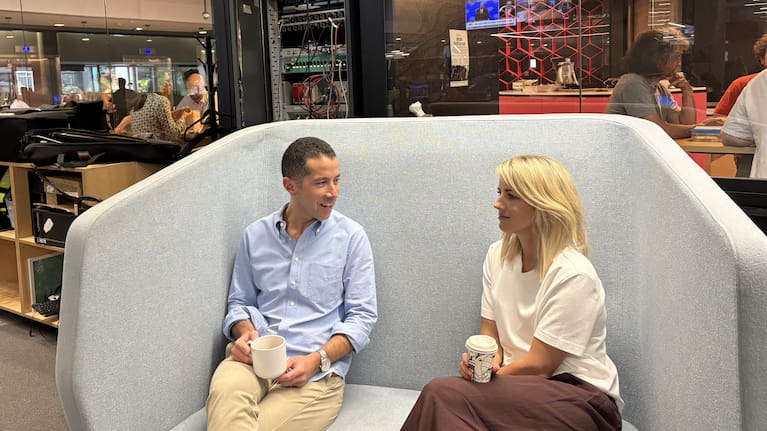 The long-time colleagues catch up in the TVNZ office.