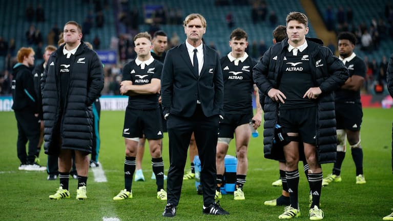 All Blacks head coach Scott Robertson and his team, including Beauden Barrett, right, react to the defeat to England at Twickenham.