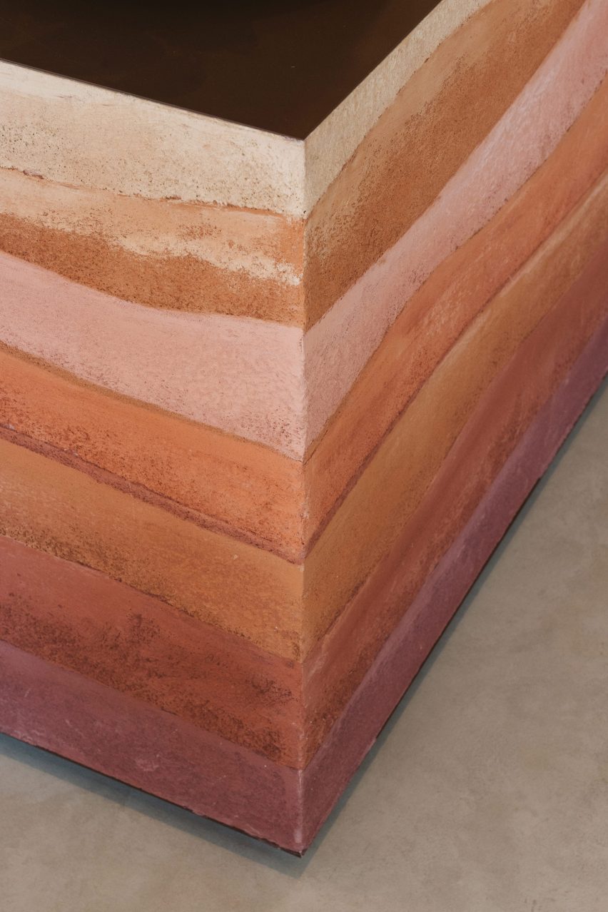 Rammed-earth welcome desk by Anomaly and Clayworks