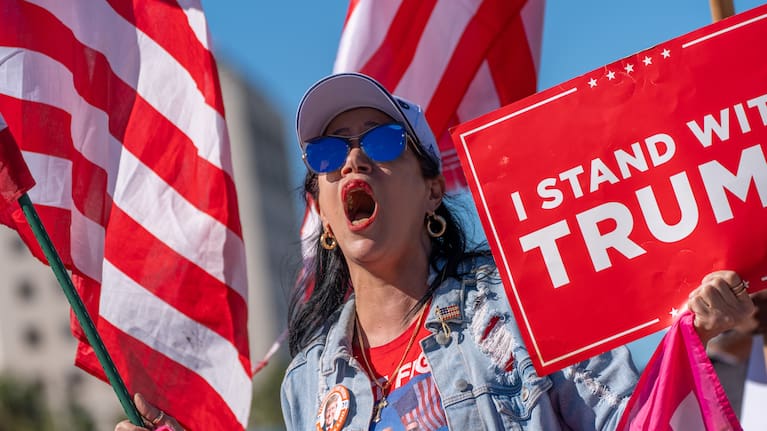 Maribel Gonzalez celebrates outside Versailles Cuban Cuisine after President Donald Trump announced President Nicolás Maduro had been captured and flown out of Venezuela, in Miami, Saturday, January 3, 2026.