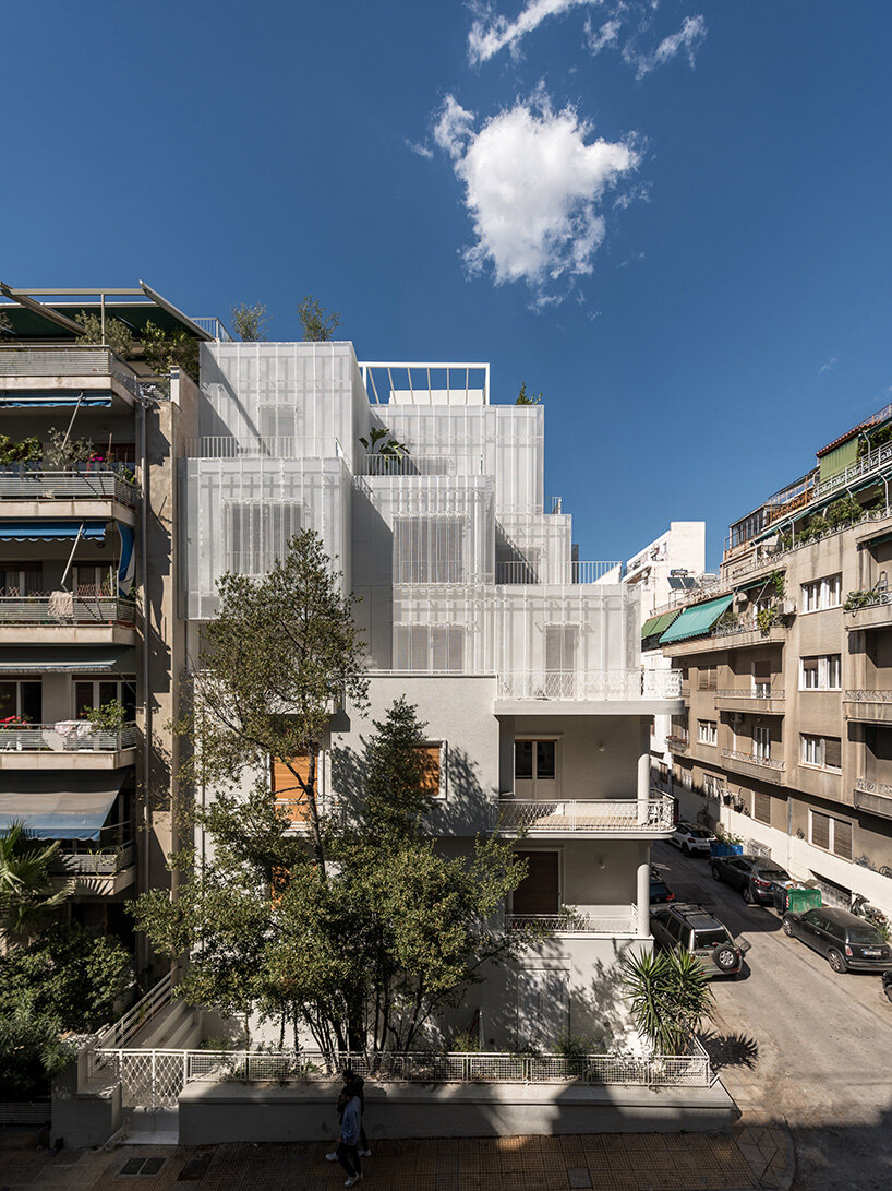 layered lightweight volumes by arid extend 1950s building in patissia, athens
