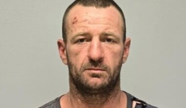 Small NSW town 'rocked' by triple homicide as manhunt continues