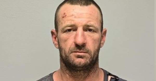 Small NSW town 'rocked' by triple homicide as manhunt continues