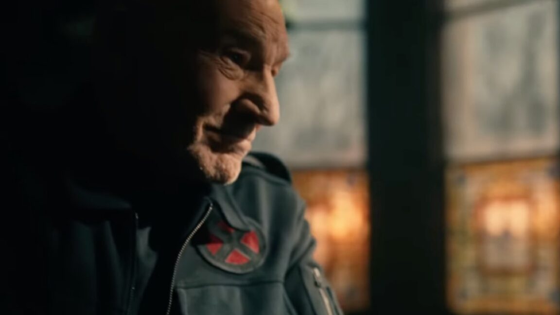 side view Patrick Stewart as Professor X looking at someone sitting across from him