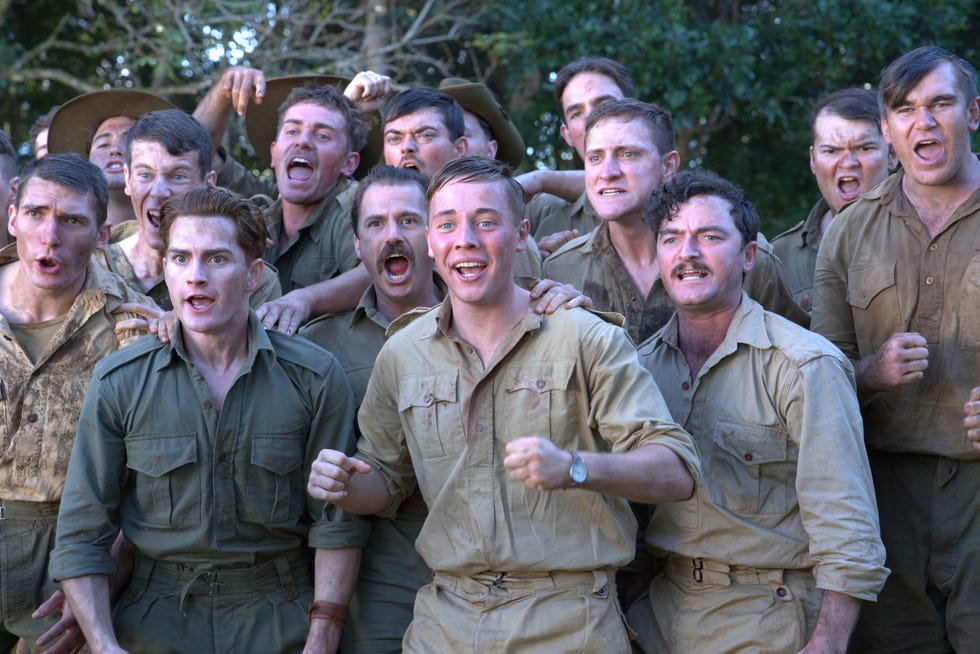 group of individuals wearing military uniforms with a focus on camaraderie group of individuals wearing military uniforms with a focus on camaraderie