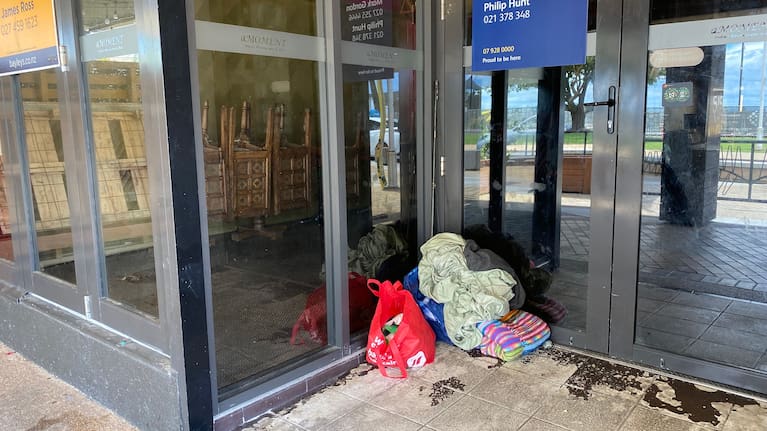 Belongings in the doorway of a vacant premises on The Strand in Tauranga