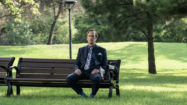 Bob Odenkirk's Jimmy McGill sitting on a park bench on Better Call Saul