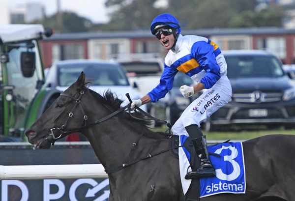 Expat Kiwi jockey Logan Bates is jubilant after recording his first Group One victory aboard Jigsaw in the Sistema Railway at Ellerslie on Saturday.  Photo: Megan Liefting (Race Images)