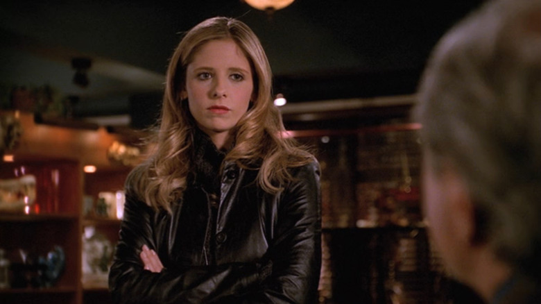 Buffy (Sarah Michelle Gellar) frowning at Watcher's Council on Buffy the Vampire Slayer
