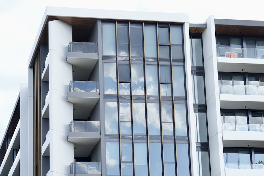 The exteior of a modern apartment block.