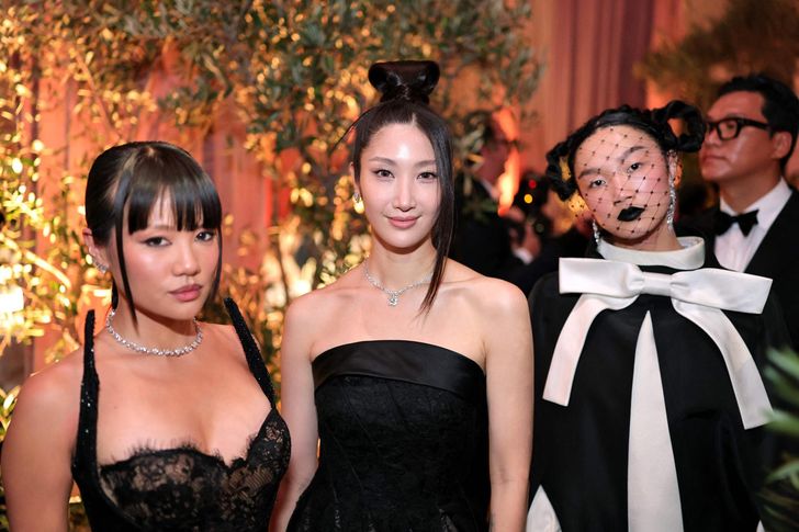 From left, Rei Ami, EJAE and Audrey Nuna attend the 83rd Golden Globe Awards at The Beverly Hilton in Beverly Hills, Calif., Sunday (local time). AFP-Yonhap