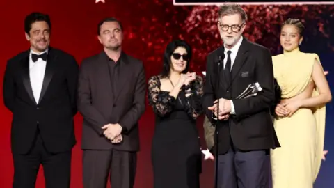 Getty Images Benicio del Toro, Leonardo DiCaprio, Cassandra Kulukundis, Paul Thomas Anderson and Chase Infiniti at the 31st Annual Critics Choice Awards held at the Barker Hangar on January 04, 2026 in Santa Monica, California. 