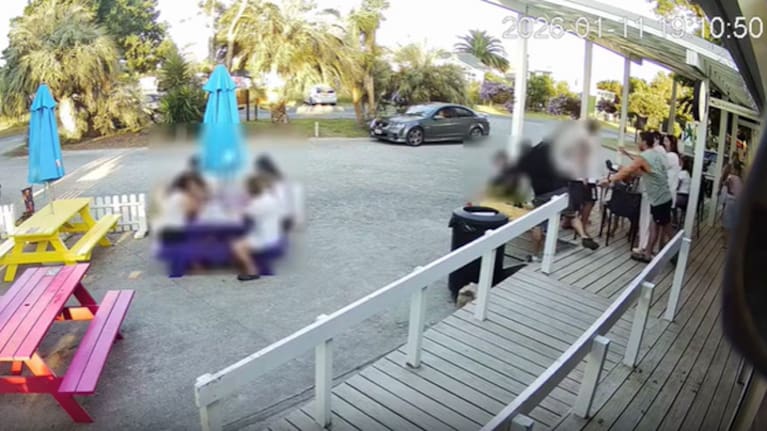 CCTV still of Dallas Gurney being shoved off the deck of the Whananaki General Store in Whananaki. (Source: Dallas Gurney / Whananaki FM)