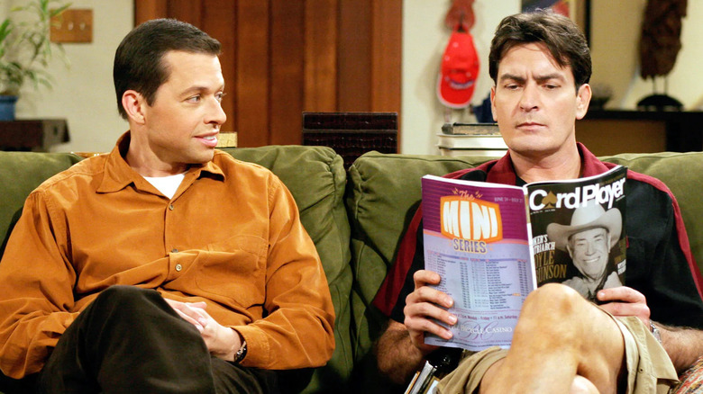 Jon Cryer as Alan and Charlie Sheen as Charlie reading a magazine in Two and a Half Men