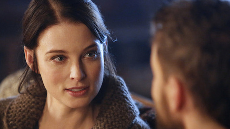 Kiera Cameron (Rachel Nichols) stares intently at a man in Continuum